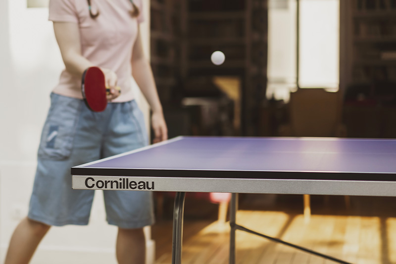 player on the Cornilleau 100 indoor table tennis table
